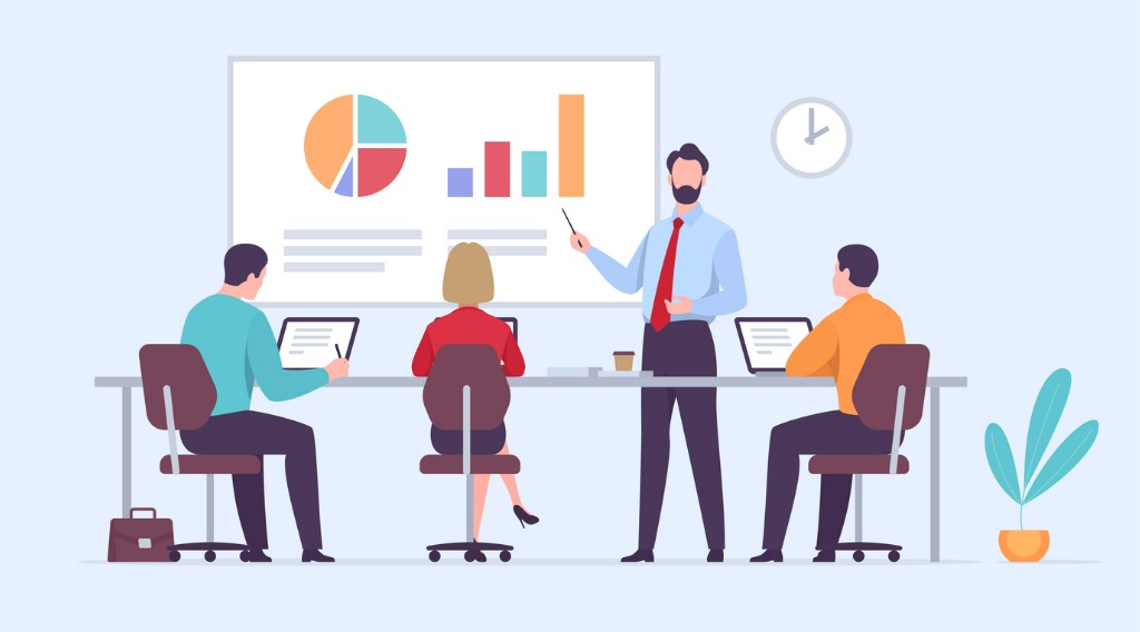 man showing data to coworkers on large screen