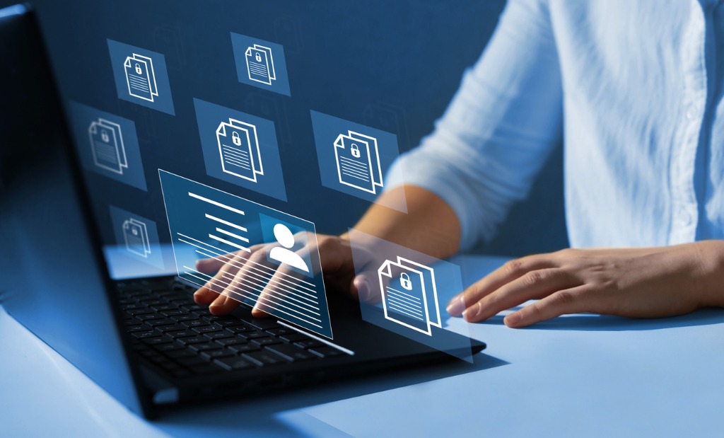 Woman reviewing document management system